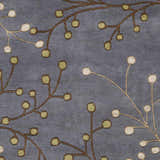 Close-up of the Elsu Brown Beige Wool Rug featuring a floral pattern with brown branches and beige and green buds. Swatch