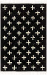 Close-up of the Anda White Cross on Black Plush Rug, featuring a plus sign pattern and white fringe. Design-Rectangle-537