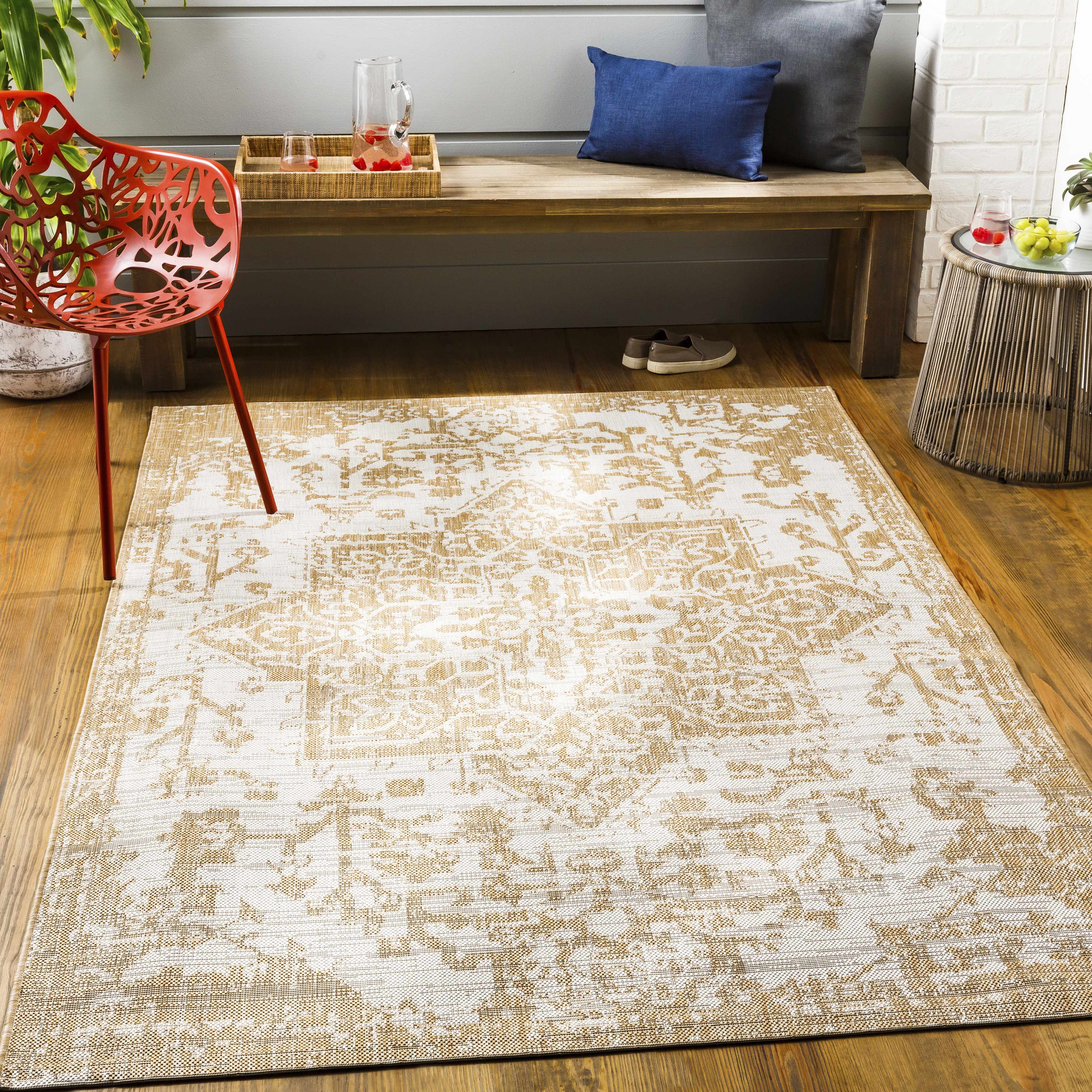 Tan Kilmacolm Outdoor Rug - Clearance placed in a styled room setting, harmonizing with surrounding room decor. Traditional Area Rug Backing  