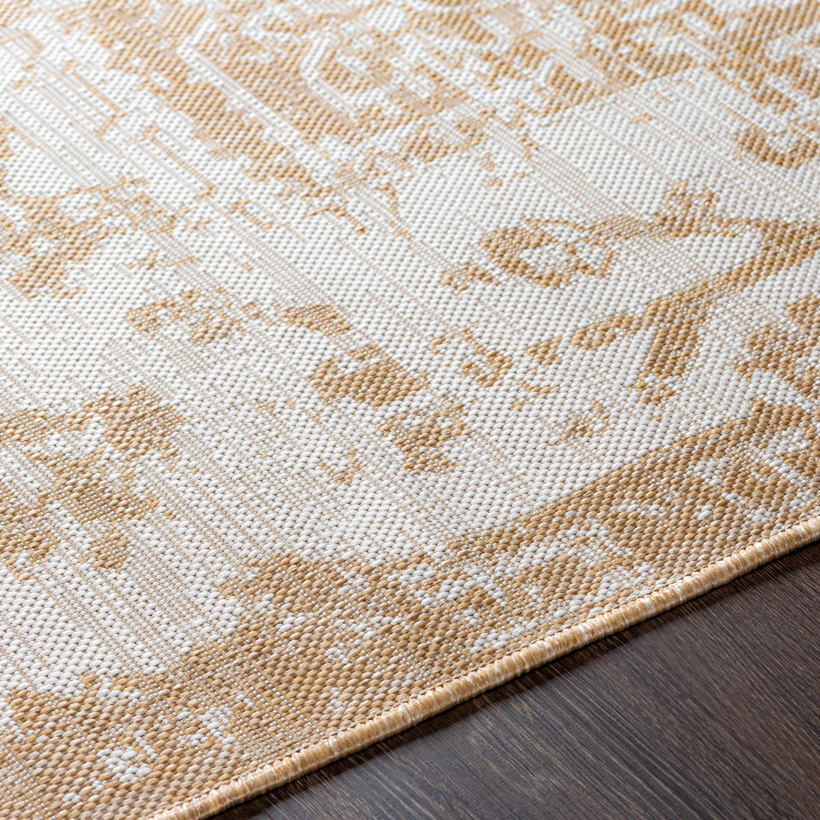 Close-up of the texture on Tan Kilmacolm Outdoor Rug - Clearance, showing fabric weave and feel. Traditional Area Rug Backing  