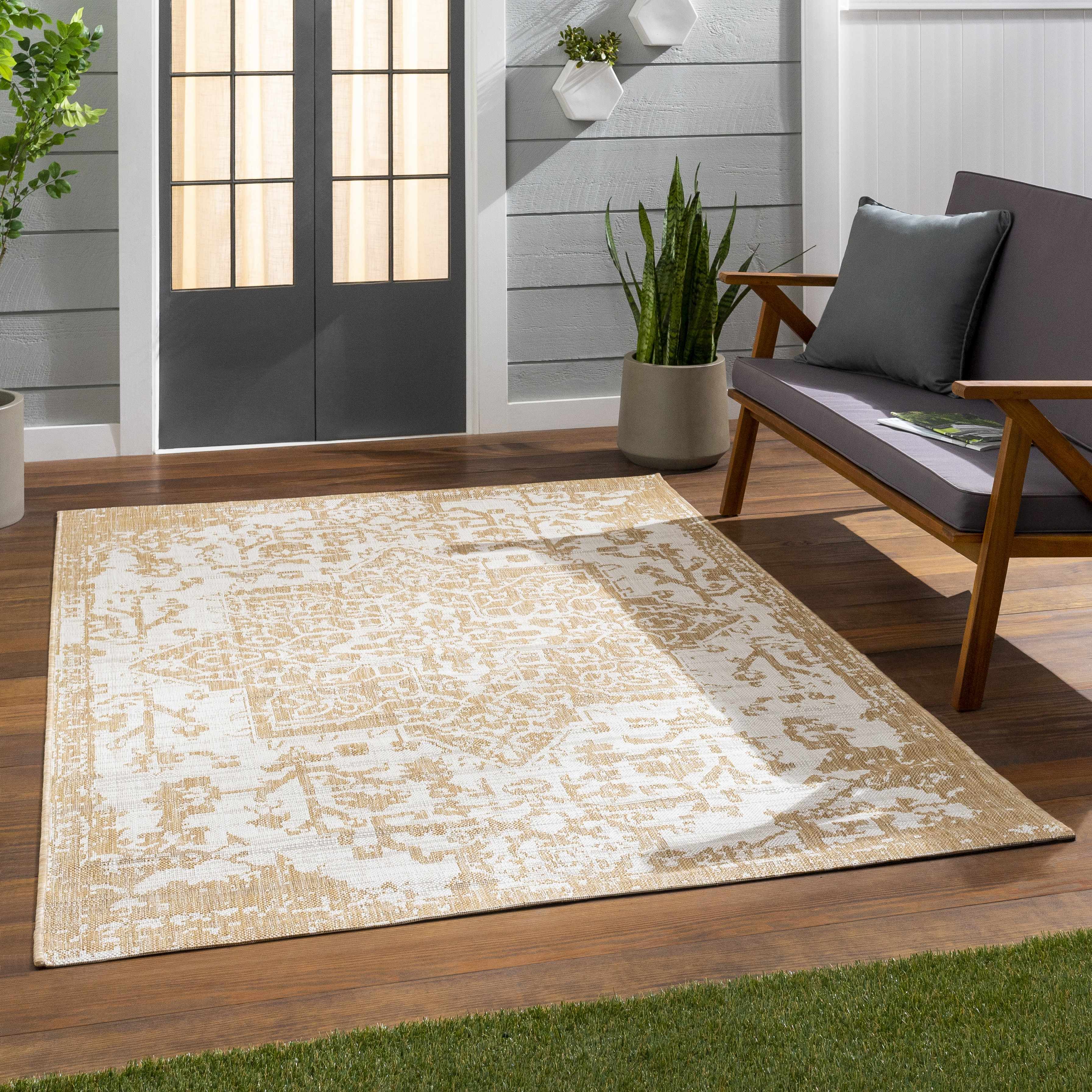 Tan Kilmacolm Outdoor Rug - Clearance placed in a styled room setting, harmonizing with surrounding room decor. Traditional Area Rug Backing  