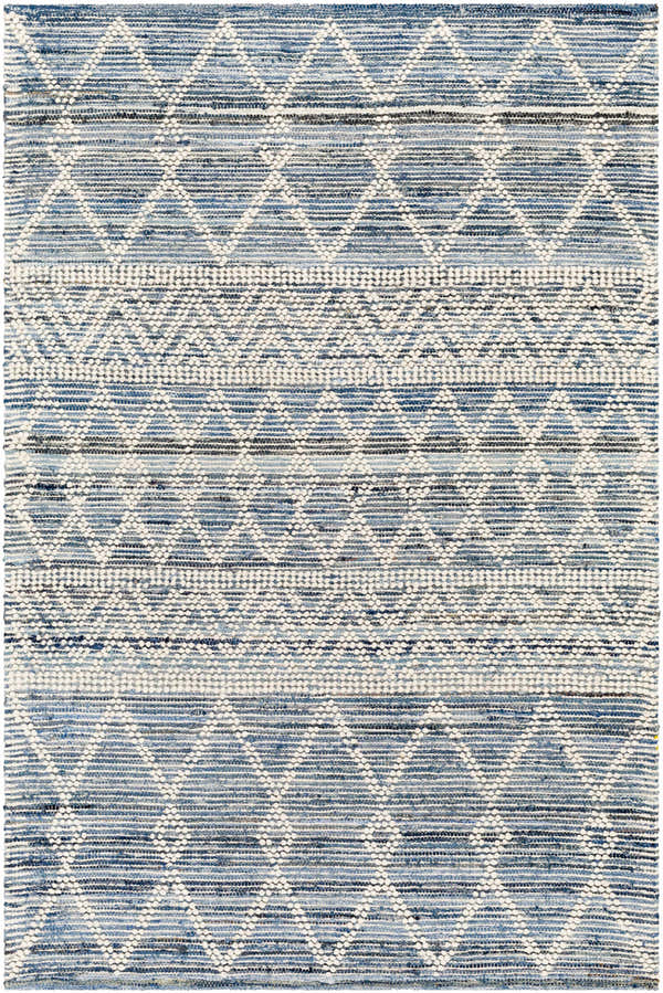 Close-up of the hand woven Nala Area Carpet. Bohemian style rug in charcoal, light blue, and off white. Design-Rectangle-576