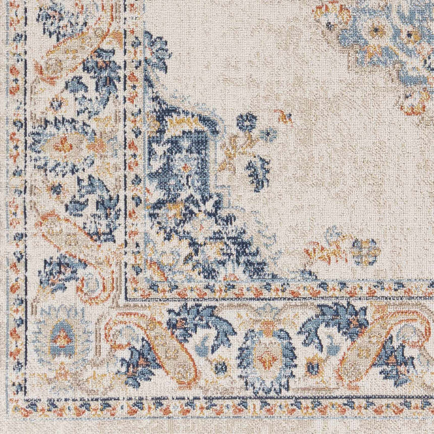 Close-up of Neepawa Area Carpet showing a traditional design in cream, blue, and orange tones. Machine woven texture detail. Swatch