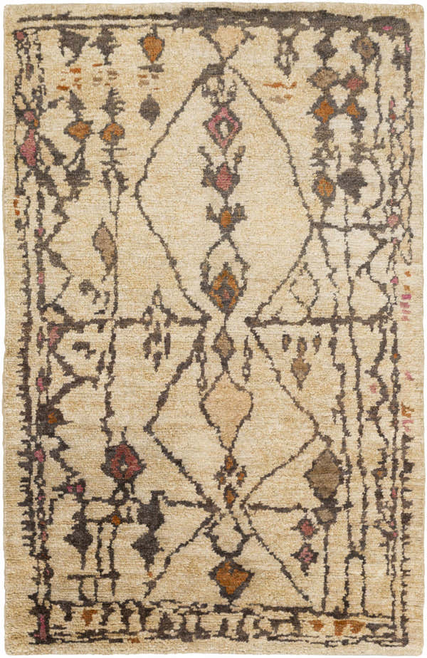 Close-up of the Neeses Premium Jute Rug. Beige jute rug with brown, burnt orange, and rose bohemian-style pattern. Hand-knotted texture. Design-Rectangle-69