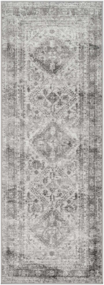 Close-up of the Nelsonville Area Rug. Charcoal, gray, and white vintage-style rug with a traditional oriental pattern. Design-Runner-2773