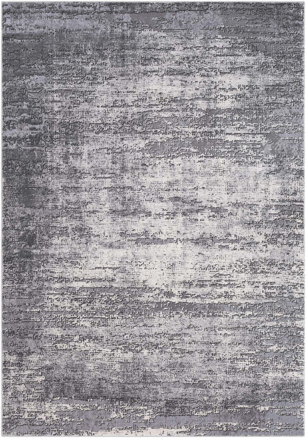 Close-up of the Nesmith Updated Traditional Tibetan Rug; a charcoal, gray, and medium gray rug with a distressed, textured pattern. Design-Rectangle-5376