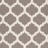 Close up of the Neshkoro Wool Area Rug. Gray rug with a light beige quatrefoil pattern. Hand woven texture. Swatch