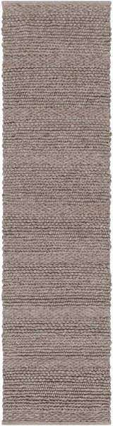 Close-up of the hand woven Newfolden Area Carpet. Brown, charcoal, and ivory wool rug with a textured, natural fiber look. Design-Runner-2610