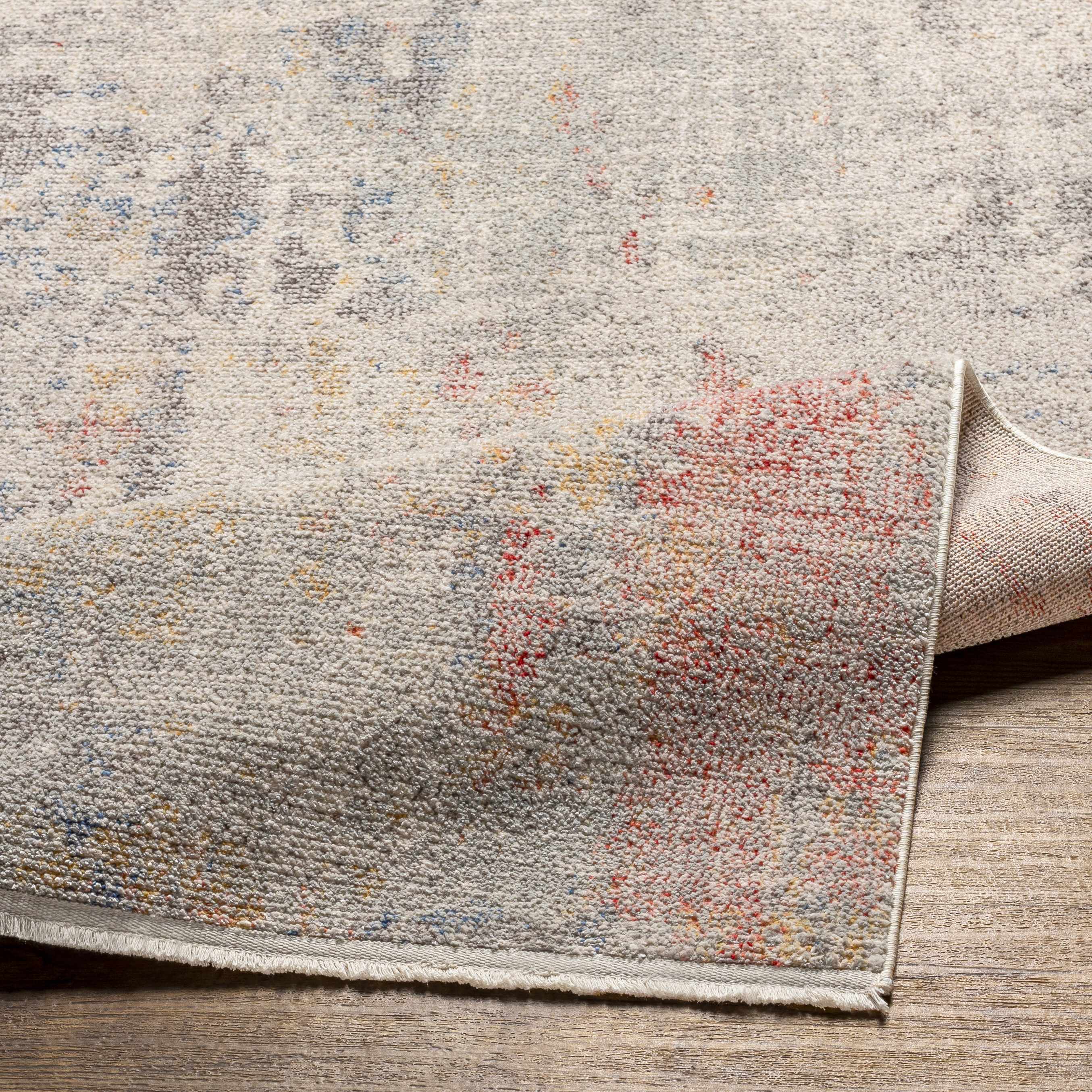 Folded section of Nile Area Rug - Clearance, displaying material thickness and weave. Contemporary Area Rug Backing  