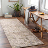 Entryway with Namboongan Area Rug in charcoal, cream, and gray. Wooden bench, shoes, and plant create a welcoming scene. Roomscene-Runner