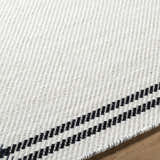 Close up of the hand woven Nimue Cream & Blue Bordered Area Rug showing wool texture and striped border detail. Texture