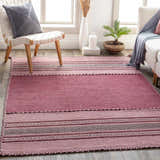 Living room scene with pink Northorpe Area Rug, white chair, and sofa. Farmhouse style with natural light. Roomscene-Rectangle