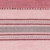 Close-up of the hand woven Northorpe Area Rug. Burgundy, pink, and white geometric pattern on cotton. Farmhouse style. Swatch