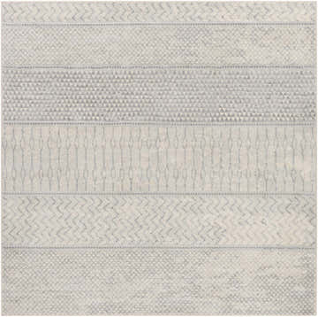 Close-up of the Nunda Gray Rug. Ivory rug with gray geometric patterns: triangles, diamonds, zigzags, and ovals. Design-Square-67