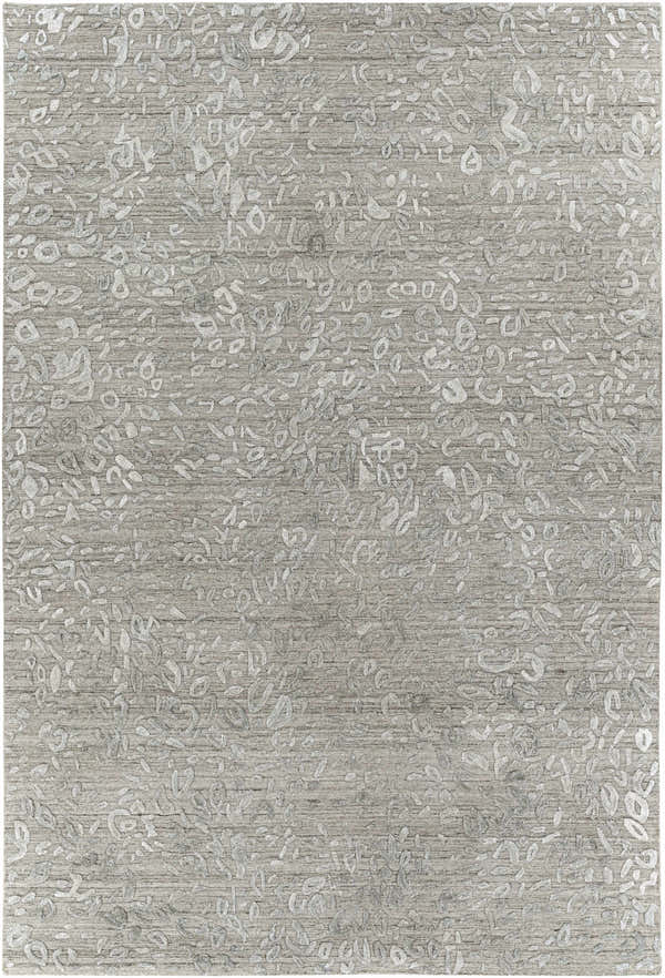 Close-up of the Newburn Area Carpet. Charcoal gray rug with a subtle, raised light gray abstract pattern. Hand-loomed texture. Design-Rectangle-69