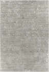 Close-up of the Newburn Area Carpet. Charcoal gray rug with a subtle, raised light gray abstract pattern. Hand-loomed texture. Design-Rectangle-69