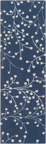 Close-up of the Blue Elsu Area Rug, featuring a floral branch pattern in tan against an ink blue background. Design-Runner-268