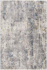 Close-up of the Odell Abstract Luxe Fringe Rug, featuring a distressed geometric pattern in blues, grays, and mustard. Design-Rectangle-575