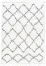 Close-up of the Ogallah Area Rug. White shag rug with a gray diamond Moroccan-inspired pattern and tassels. Design-Rectangle-5373