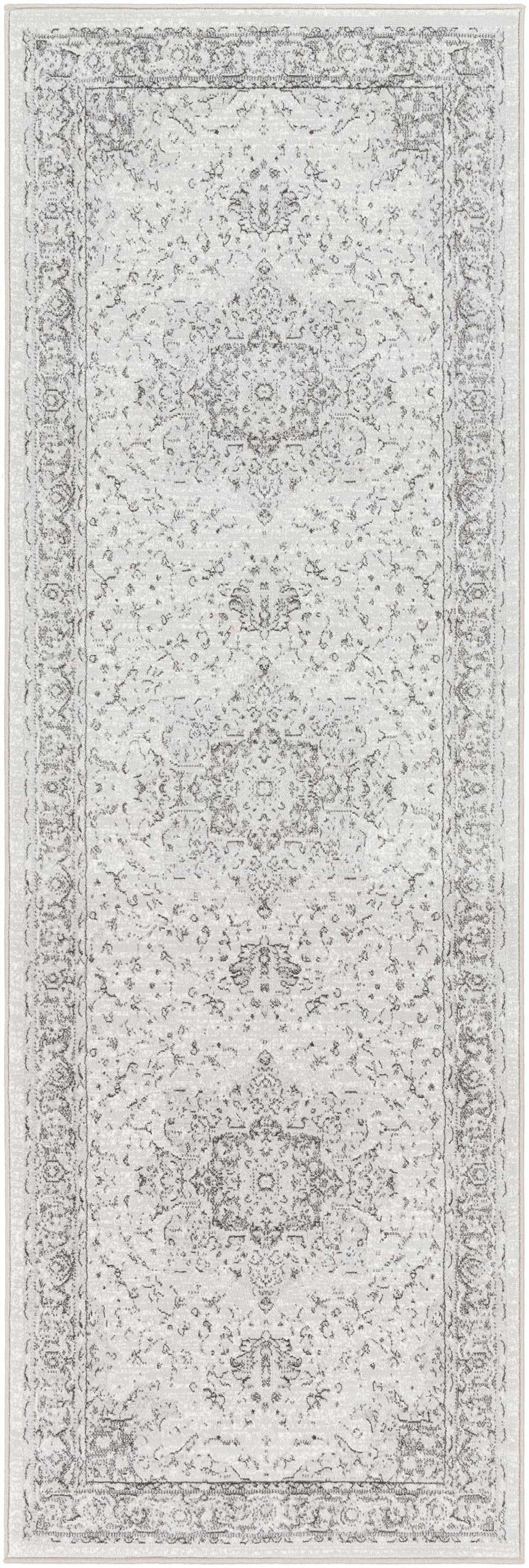 Close-up of the Okehampton Area Rug, a traditional runner in charcoal, light gray, and white. Machine woven polypropylene. Design-Runner-27710