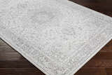 Close-up of the Okehampton Area Rug in charcoal, light gray, and white, showcasing its traditional, farmhouse-style pattern. Corner