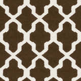 Close-up of the Okoboji Area Rug. Hand-woven wool rug features a dark brown and ivory geometric trellis pattern. Swatch