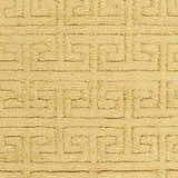 Close-up of the mustard Omagh Area Rug. Hand-woven wool rug with a geometric Greek key pattern. Shag texture. Swatch