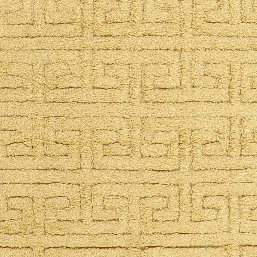 Close-up of the mustard Omagh Area Rug. Hand-woven wool rug with a geometric Greek key pattern. Shag texture. Swatch