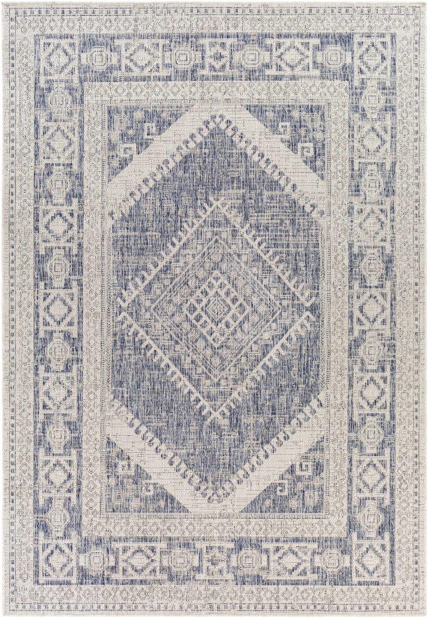 Close-up of the Umraniye Gray Area Rug. Features a geometric, diamond pattern in shades of blue, gray, and off-white. Design-Rectangle-537