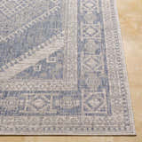 Close up of the blue and gray geometric pattern on the Umraniye Gray Area Rug. Front