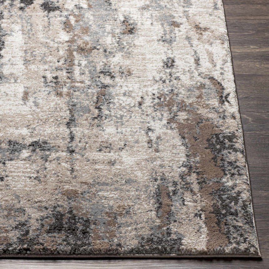 Close up of the Opunake Luxe Thick Area Rug showing its abstract pattern and colors: cream, gray, brown, and black. Front