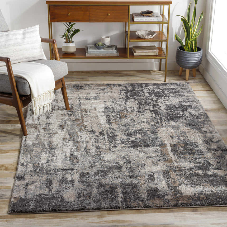 Living room scene with Opunake Luxe Thick Area Rug in black, brown, charcoal, cream, gray, and tan. Contemporary style. Roomscene-Rectangle
