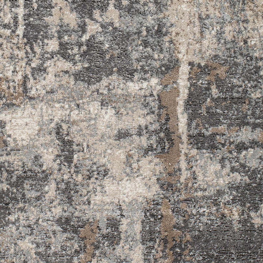 Close-up of the Opunake Luxe Thick Area Rug showing its black, brown, cream and gray abstract pattern and plush texture. Swatch