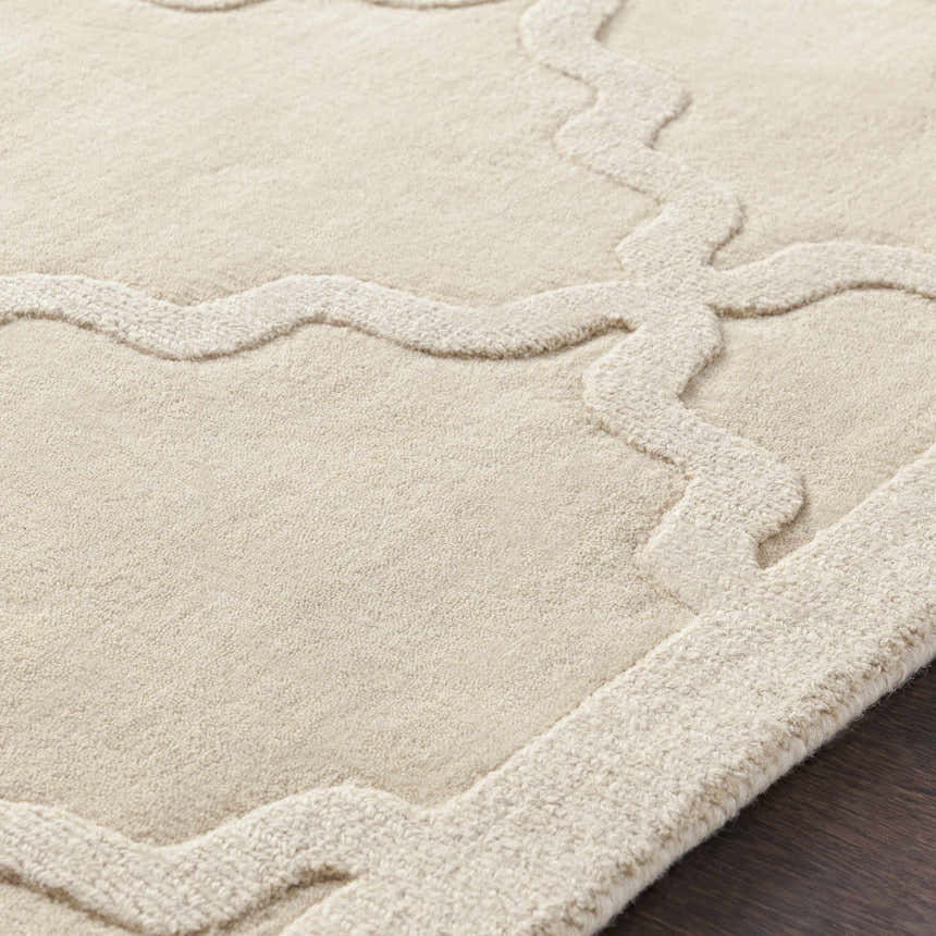 Close-up of the beige Orick Hand Loomed Wool Area Rug, showing its texture and contemporary trellis design. Texture