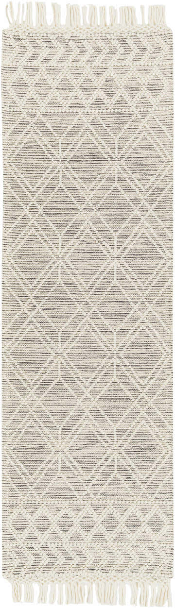 Close-up of the Ossun Wool Rug. Cream rug with black geometric pattern and tassels. Farmhouse style. Design-Runner-268
