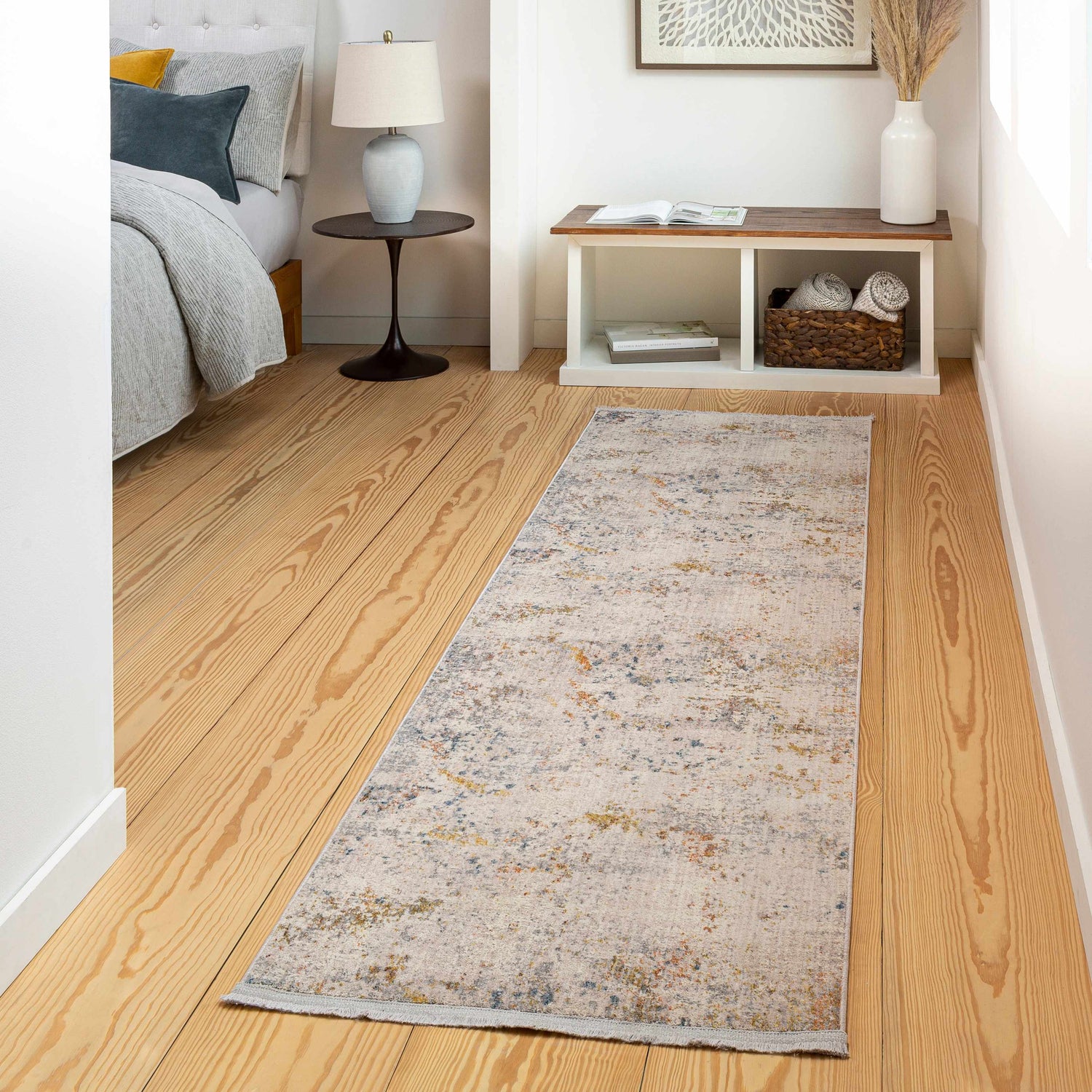 Bedroom scene with a Palhi Area Carpet runner in brick red, cream, and blue on wood floors. Contemporary style. Roomscene-Runner