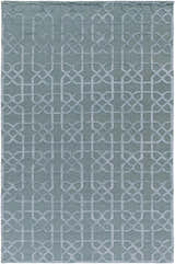 Close-up of the Paskenta Area Carpet. Light sage wool rug with a traditional geometric pattern. Hand-knotted texture. Design-Rectangle