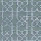 Close-up of the Paskenta Area Carpet. Light sage wool rug with a geometric trellis pattern. Hand-knotted texture. Swatch