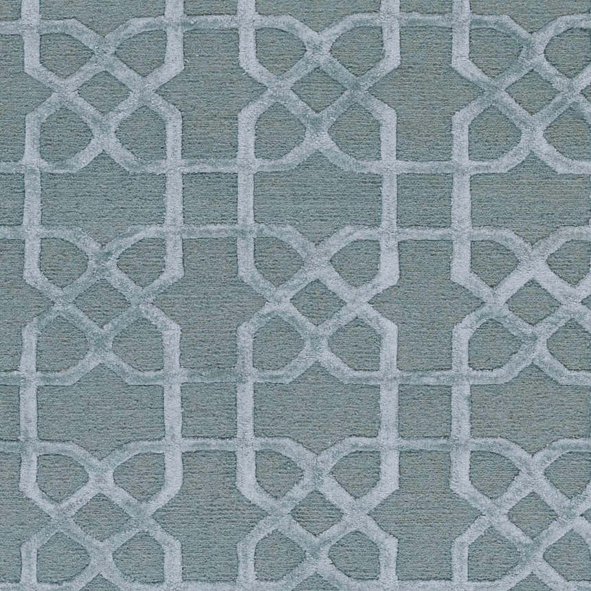Close-up of the Paskenta Area Carpet. Light sage wool rug with a geometric trellis pattern. Hand-knotted texture. Swatch