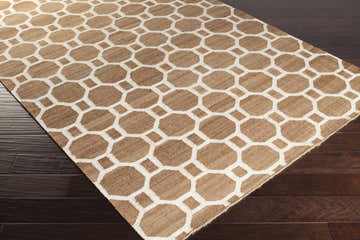 Close-up of the Pattersonvle Area Carpet showing its brown and white geometric pattern and jute texture on dark wood floors. Corner