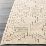 Close-up of the hand-knotted Pawhuska Area Rug. Charcoal geometric pattern on a cream wool rug. Farmhouse style. Front