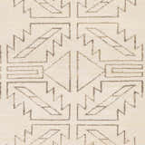Close-up of the hand-knotted Pawhuska Area Rug. Charcoal and peach geometric shapes on a cream wool background. Swatch
