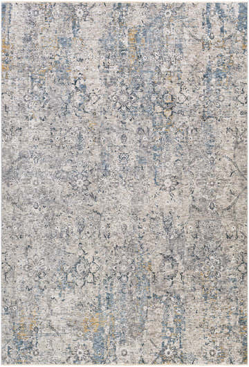 Close-up of the Pence Luxe Fringe Rug. Beige, blue, and charcoal floral pattern with a distressed, vintage look. Design-Rectangle-6796