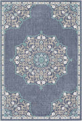 Detailed view of the Penland Area Rug showcasing its navy, teal, and taupe floral medallion design. Design-Rectangle-5376