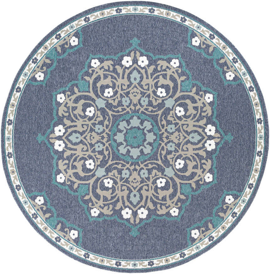 Close-up of the round Penland Area Rug. Navy olefin rug with a teal, taupe, and white floral medallion pattern. Design-Round-89