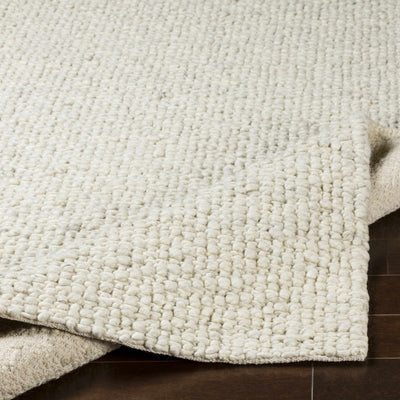 Penmaenmawr Solid Cream Premium Woven Wool Area Rug