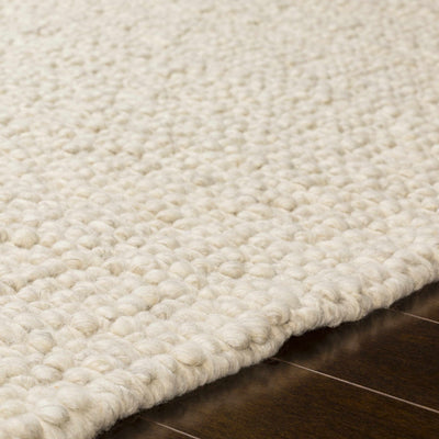 Penmaenmawr Solid Cream Premium Woven Wool Area Rug