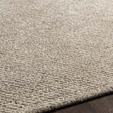 Close-up of the Phalaborwa Area Rug showing its light beige, tan, and gray tones and hand-loomed texture. Texture