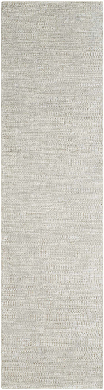 Close-up of the Pabla Light Gray Area Rug. Machine woven polyester rug with a subtle, textured light gray and medium gray pattern. Design-Runner-2710