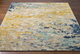 Close-up of the Pias Area Rug showing its contemporary design, beige, gray, blue, and mustard colors, and hand-knotted wool texture. Front